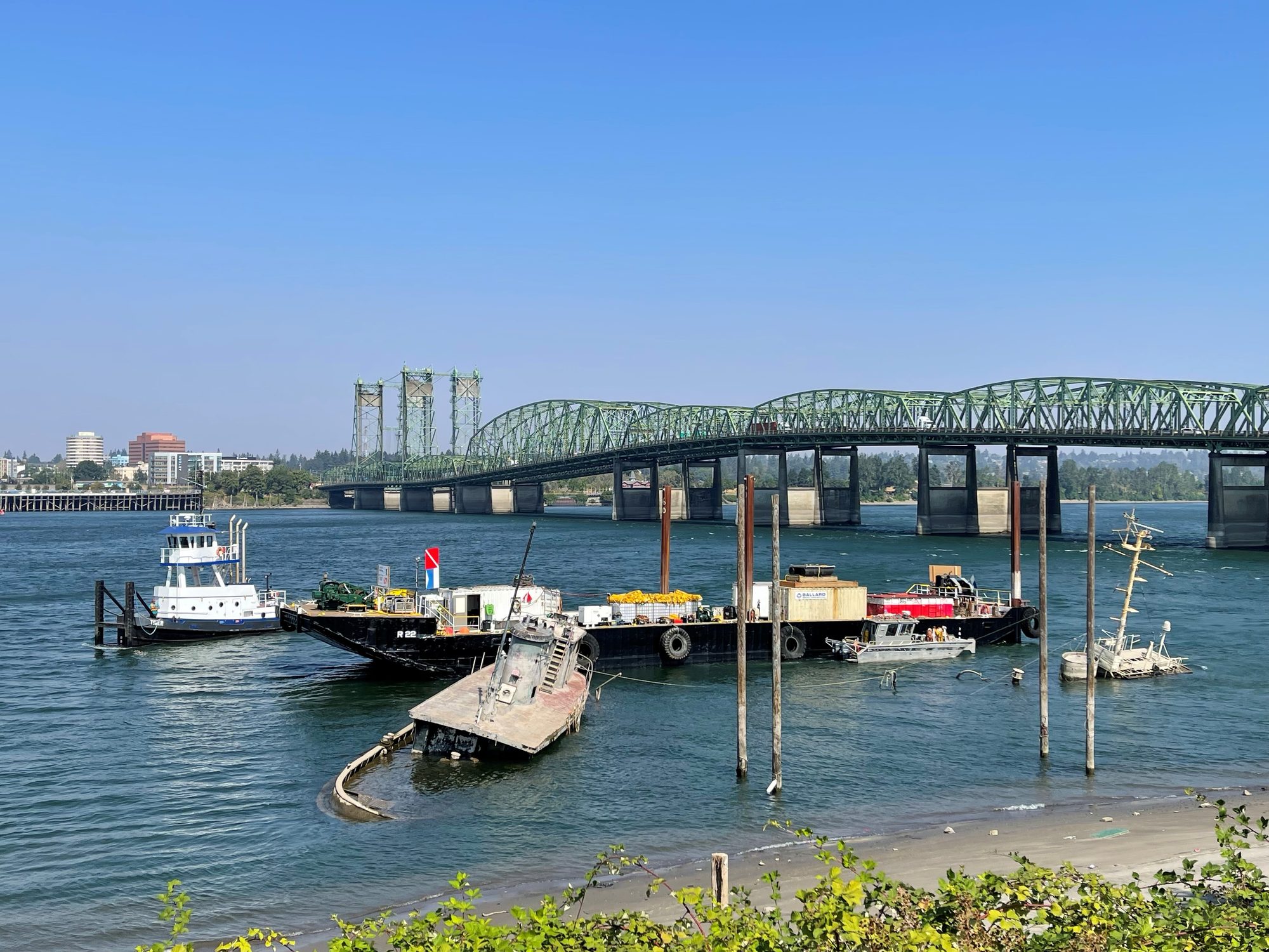 AX22 barge alongside a sunken vessel near the Interstate Bridge