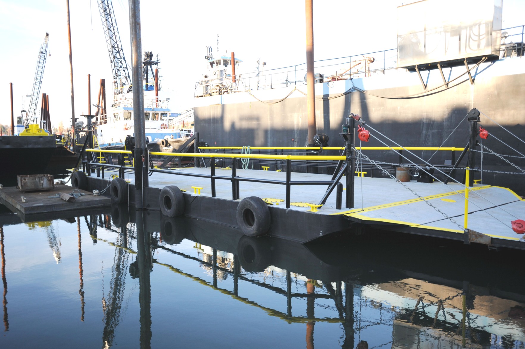 AX50 barge moored alongside at the yard