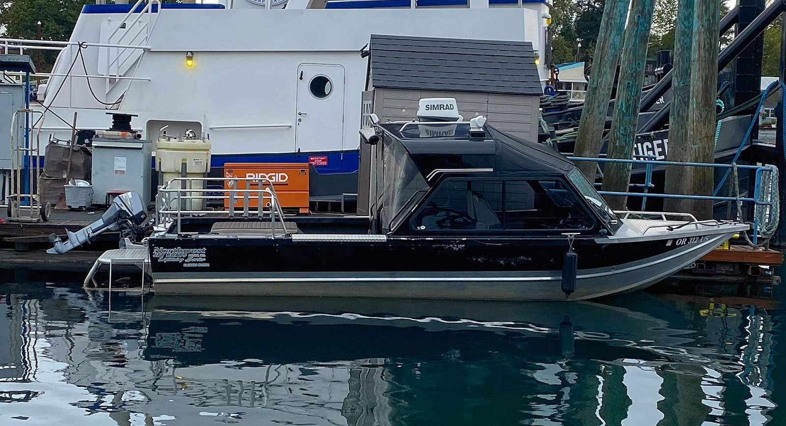 NW JET BOAT alongside the dock